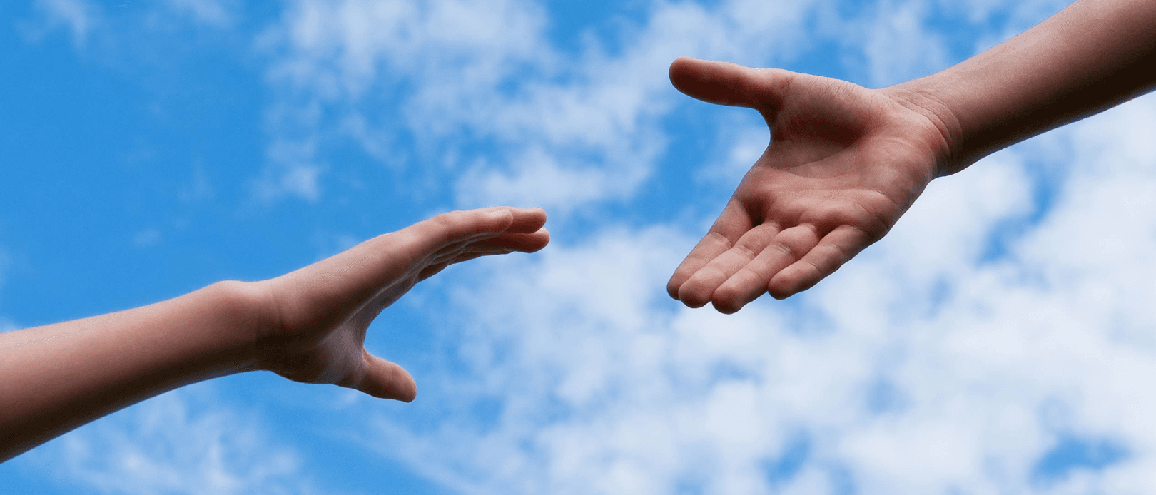 Hands reaching out for each other